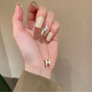 Gold and White Pendant Necklace